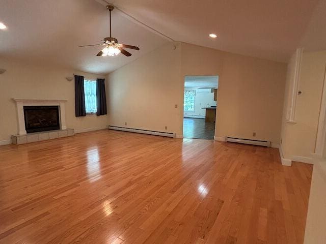 1 S Ridge Dr, Winslow, ME 04901 - unfurnished living room with a baseboard radiator, ceiling fan, and light wood-style flooring