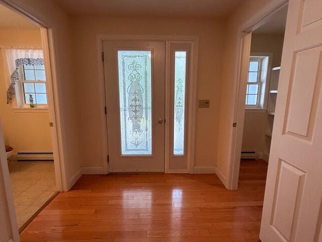 1 S Ridge Dr, Winslow, ME 04901 - foyer featuring a baseboard heating unit and light wood-style floors