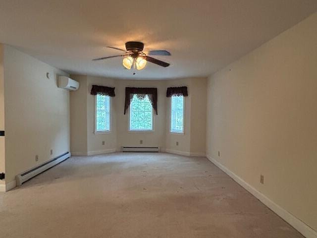 1 S Ridge Dr, Winslow, ME 04901 - unfurnished room featuring a baseboard radiator, a wall mounted air conditioner, ceiling fan, and light carpet