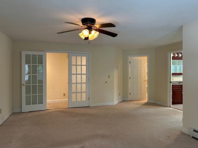 1 S Ridge Dr, Winslow, ME 04901 - spare room with light colored carpet, a ceiling fan, and baseboard heating
