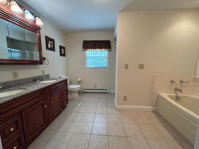 1 S Ridge Dr, Winslow, ME 04901 - full bath featuring a baseboard heating unit, tile patterned floors, double vanity, and a garden tub