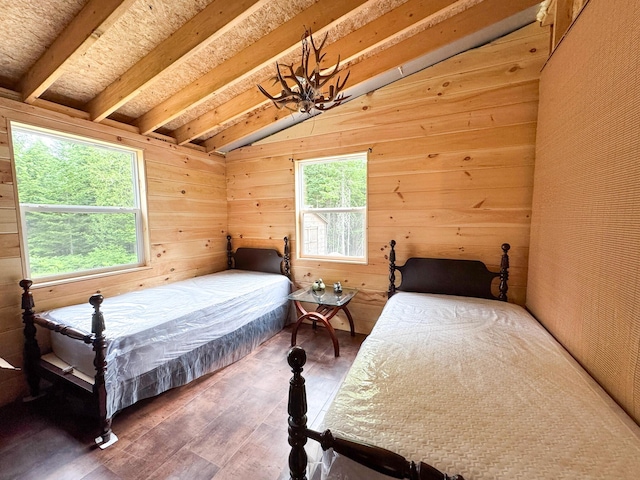 147 Loop Rd, Lincoln, ME 04457 - bedroom with wood finished floors and wooden walls