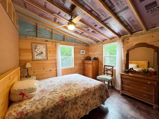 147 Loop Rd, Lincoln, ME 04457 - bedroom with wood walls, multiple windows, and dark wood-style floors