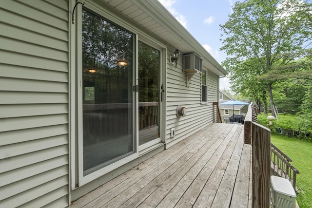 44 Ellen Cir, Yarmouth, ME 04096 - wooden terrace featuring a lawn and an AC wall unit