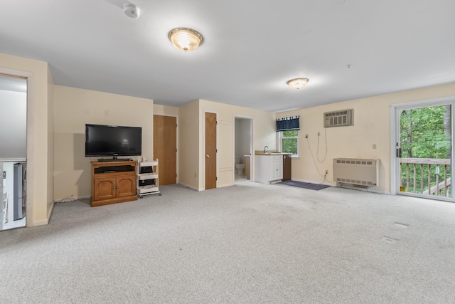 44 Ellen Cir, Yarmouth, ME 04096 - unfurnished living room with heating unit, light carpet, and a wall mounted AC