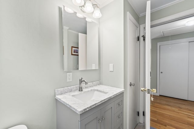 44 Ellen Cir, Yarmouth, ME 04096 - bathroom featuring wood finished floors, ornamental molding, and vanity