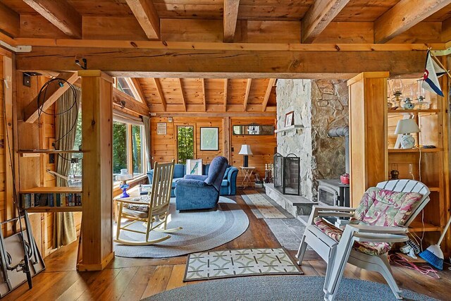 8 Horseshoe Is, Winthrop, ME 04364 - living area with wooden ceiling, hardwood / wood-style flooring, wooden walls, and a fireplace