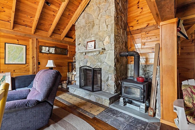 8 Horseshoe Is, Winthrop, ME 04364 - living area featuring wood walls, wooden ceiling, and a wood stove