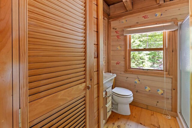 8 Horseshoe Is, Winthrop, ME 04364 - bathroom featuring wood-type flooring and wooden walls
