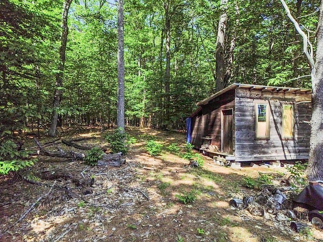 8 Horseshoe Is, Winthrop, ME 04364 - view of yard with an outdoor structure and a forest view