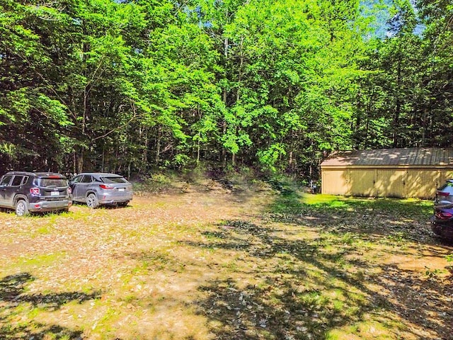 8 Horseshoe Is, Winthrop, ME 04364 - view of yard with a wooded view and an outbuilding