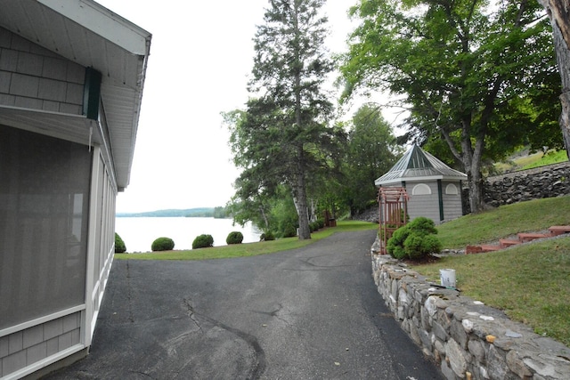 13 S Brook Ln, Eagle Lake, ME 04739 - view of asphalt driveway with a water view
