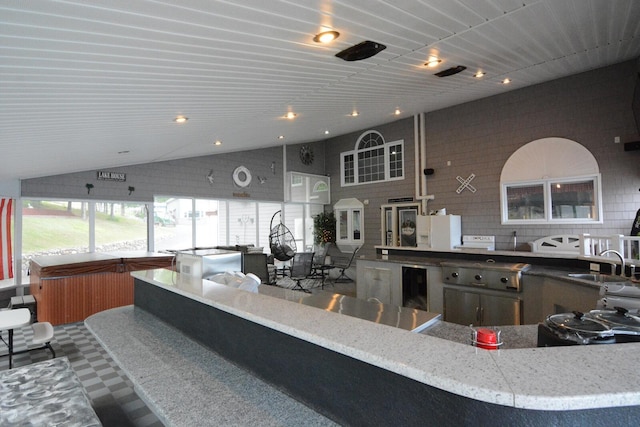 13 S Brook Ln, Eagle Lake, ME 04739 - kitchen with beverage cooler, recessed lighting, and lofted ceiling