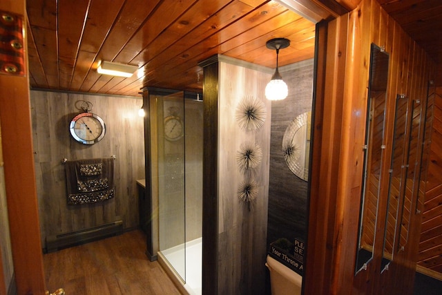 13 S Brook Ln, Eagle Lake, ME 04739 - hall with wood ceiling, wooden walls, wood finished floors, and a baseboard heating unit