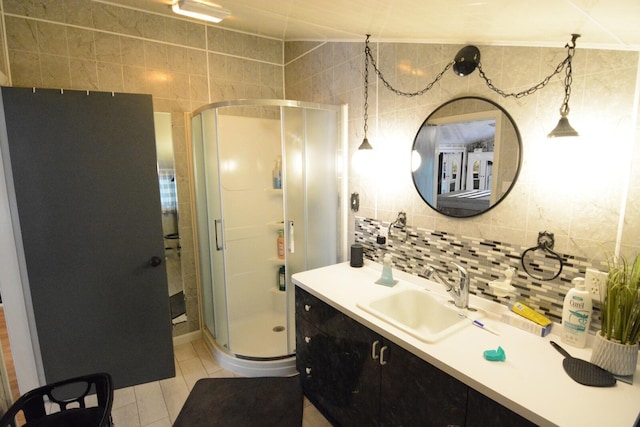 13 S Brook Ln, Eagle Lake, ME 04739 - full bathroom featuring vanity, a shower stall, decorative backsplash, tile walls, and tile patterned floors