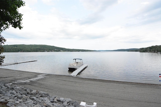 13 S Brook Ln, Eagle Lake, ME 04739 - dock with a boat ramp and a water view