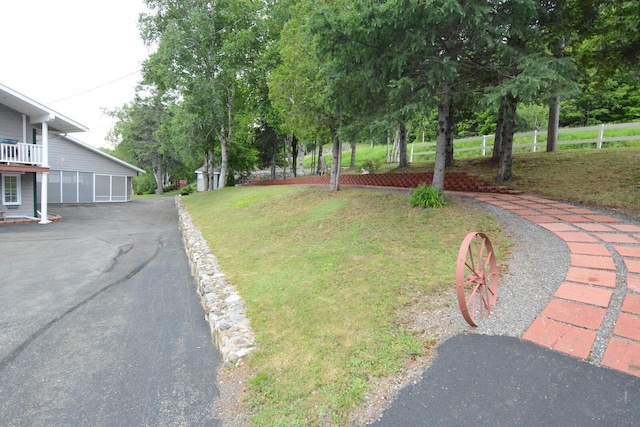 13 S Brook Ln, Eagle Lake, ME 04739 - view of green lawn featuring driveway