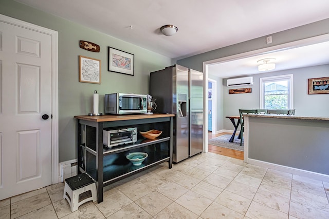 325 Ludlow St, Portland, ME 04102 - kitchen featuring appliances with stainless steel finishes and a wall mounted air conditioner