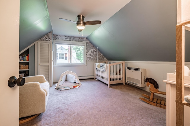 325 Ludlow St, Portland, ME 04102 - carpeted bedroom featuring a nursery area, lofted ceiling, heating unit, a baseboard radiator, and ceiling fan