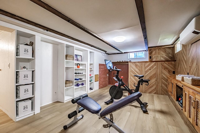 325 Ludlow St, Portland, ME 04102 - exercise room with an AC wall unit, wood finished floors, and wood walls