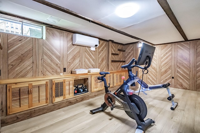325 Ludlow St, Portland, ME 04102 - exercise room with a wall mounted AC, wood finished floors, and wooden walls