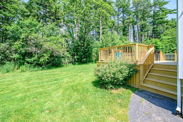 325 Ludlow St, Portland, ME 04102 - view of green lawn featuring a wooden deck and view of scattered trees