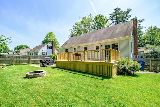 325 Ludlow St, Portland, ME 04102 - rear view of house featuring an outdoor fire pit, a wooden deck, and a chimney