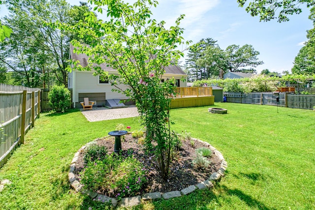 325 Ludlow St, Portland, ME 04102 - fenced backyard featuring an outdoor fire pit