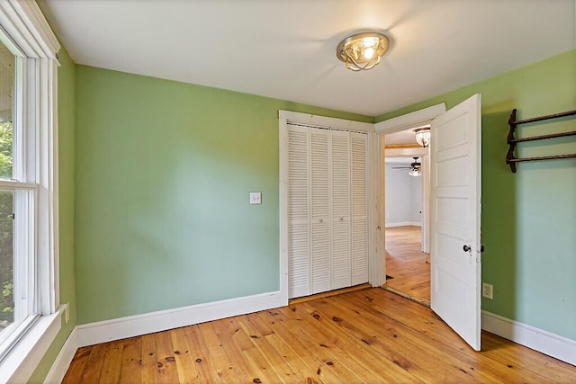 7 James St, Bingham, ME 04920 - unfurnished bedroom with hardwood / wood-style floors and multiple windows