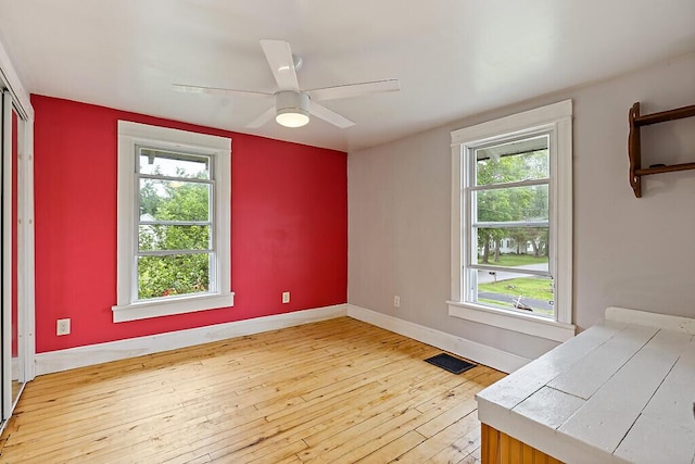 7 James St, Bingham, ME 04920 - empty room with light wood finished floors and plenty of natural light