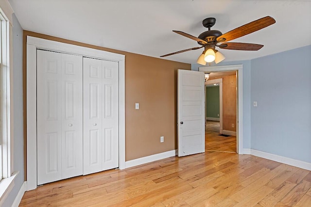 7 James St, Bingham, ME 04920 - unfurnished bedroom with a closet, light wood-type flooring, and ceiling fan