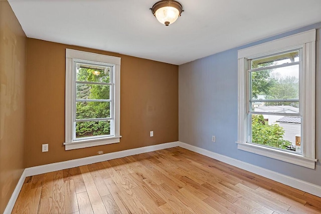 7 James St, Bingham, ME 04920 - empty room featuring light wood-style flooring and healthy amount of natural light