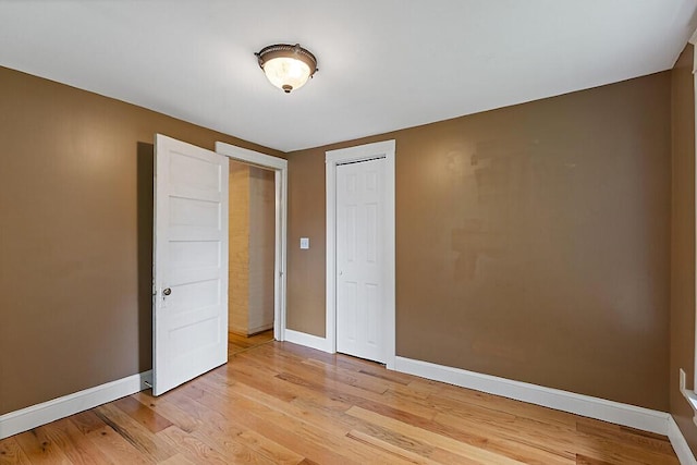 7 James St, Bingham, ME 04920 - unfurnished bedroom featuring light wood-style flooring and a closet