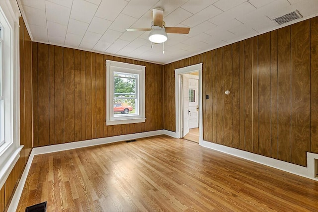 7 James St, Bingham, ME 04920 - unfurnished room with ceiling fan, wood finished floors, and wooden walls