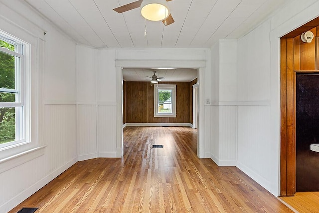 7 James St, Bingham, ME 04920 - spare room featuring ceiling fan, hardwood / wood-style floors, and a decorative wall