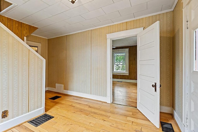 7 James St, Bingham, ME 04920 - spare room with light wood-type flooring, crown molding, and wallpapered walls