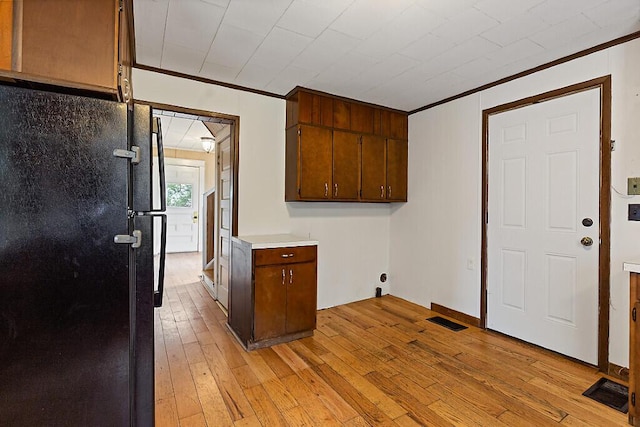 7 James St, Bingham, ME 04920 - washroom with crown molding and light wood-style flooring