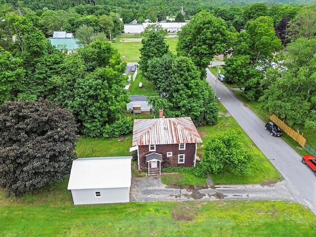 7 James St, Bingham, ME 04920 - aerial view of property and surrounding area with a heavily wooded area
