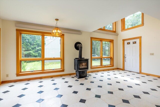 391 Main Rd, Islesboro, ME 04848 - foyer featuring baseboards and a wood stove
