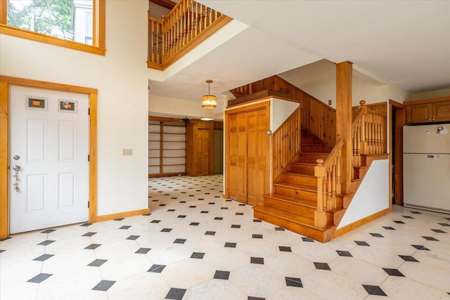 391 Main Rd, Islesboro, ME 04848 - entryway with stairway, a towering ceiling, and light flooring