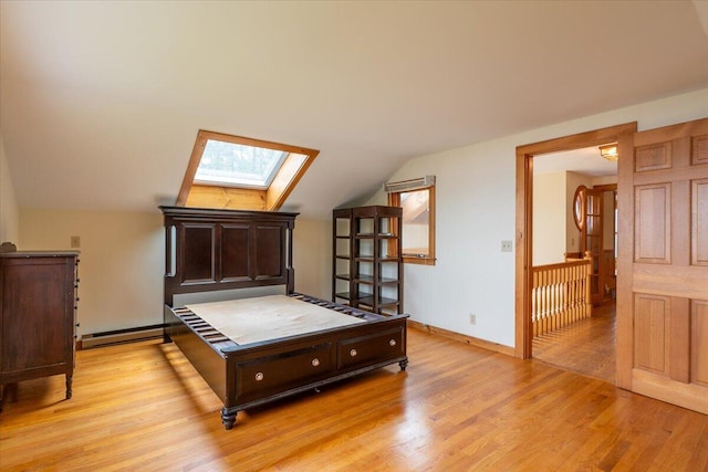 391 Main Rd, Islesboro, ME 04848 - bedroom featuring a skylight, vaulted ceiling, light wood-style flooring, and a baseboard radiator