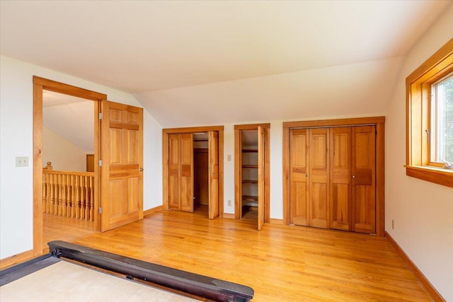 391 Main Rd, Islesboro, ME 04848 - exercise room with light wood-type flooring and vaulted ceiling