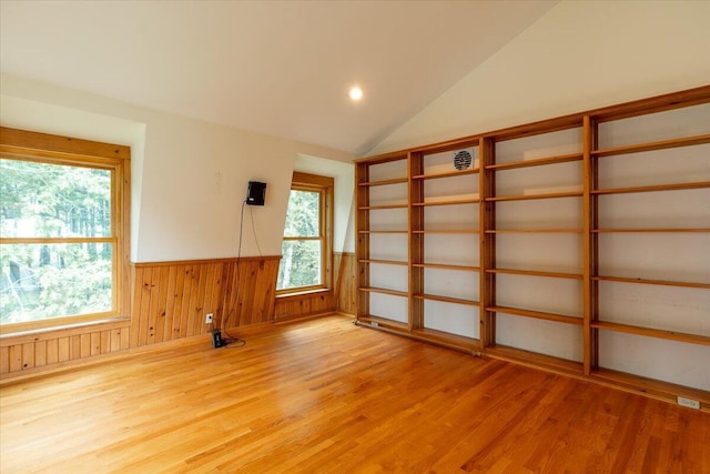 391 Main Rd, Islesboro, ME 04848 - empty room featuring light wood-style flooring, a wainscoted wall, plenty of natural light, vaulted ceiling, and recessed lighting