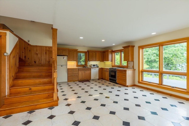 391 Main Rd, Islesboro, ME 04848 - kitchen featuring white appliances, light countertops, recessed lighting, brown cabinets, and light floors