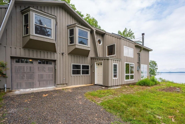 391 Main Rd, Islesboro, ME 04848 - multi unit property with a garage, a water view, and board and batten siding