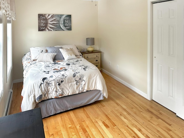 1016 State St Unit 7, Bangor, ME 04401 - bedroom with wood finished floors and baseboard heating