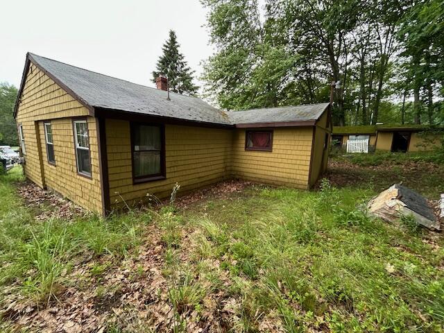 258 Guinea Rd, Biddeford, ME 04005 - back of house featuring a chimney