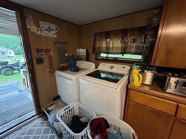 258 Guinea Rd, Biddeford, ME 04005 - laundry room featuring washing machine and clothes dryer and cabinet space