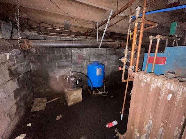 258 Guinea Rd, Biddeford, ME 04005 - unfinished basement with a water pressure tank