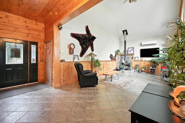 146 Lone Indian Trl, Augusta, ME 04330 - entryway featuring wooden walls, wainscoting, an AC wall unit, high vaulted ceiling, and wooden ceiling